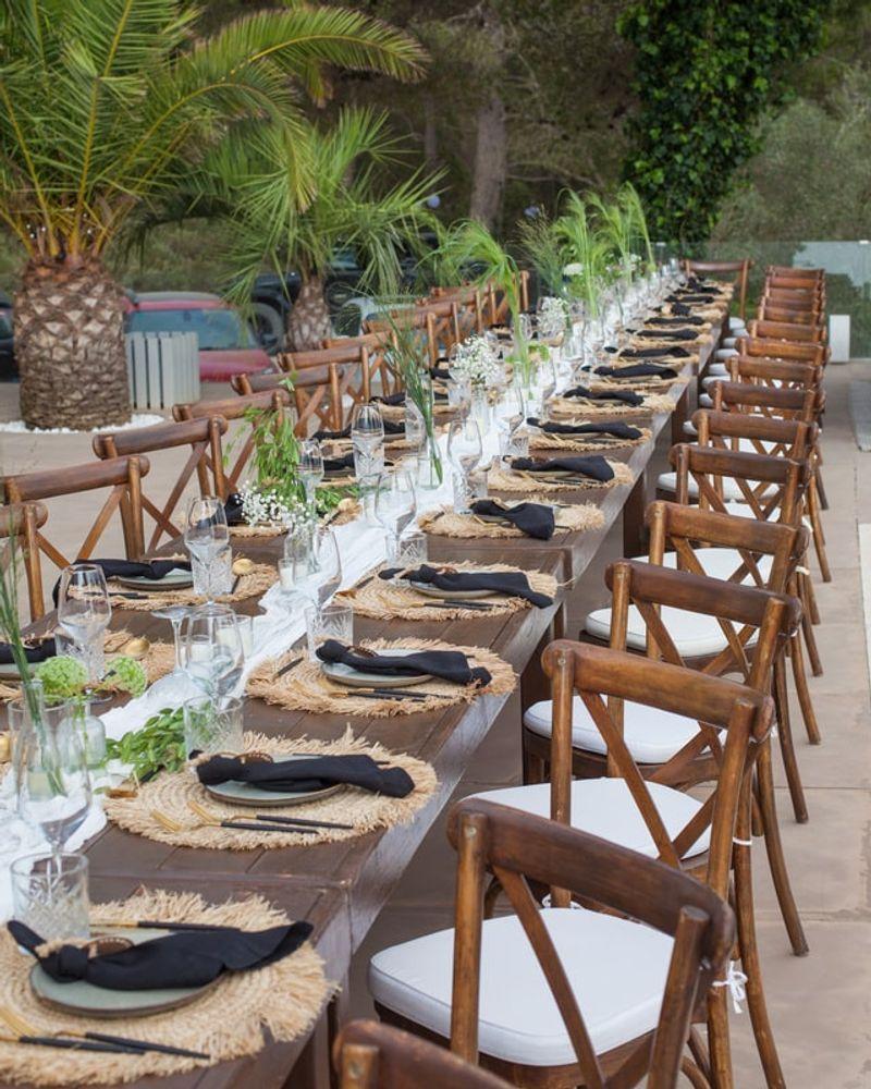 Elegantly lit table setting with pin-spot lighting at an Ibiza event