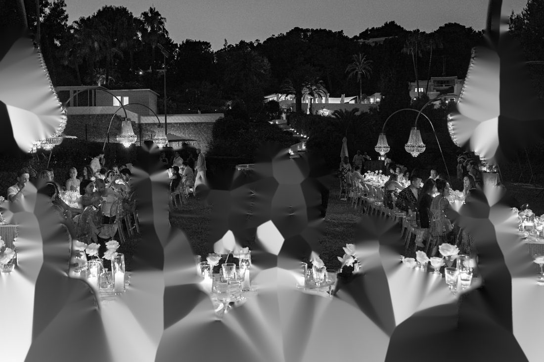 Luxury event in Ibiza — chandelier-lit garden dinner at dusk